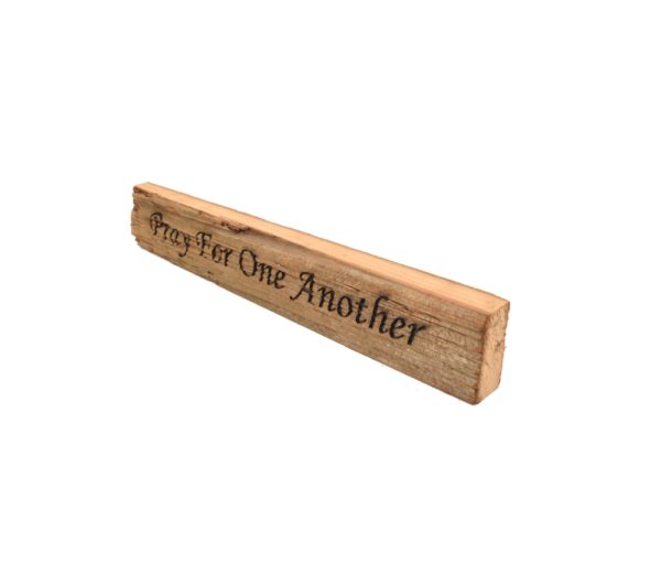 Reclaimed barn wood block sign that reads, "Pray For One Another".