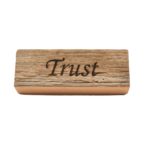 Reclaimed barnwood sign that reads, "Trust".