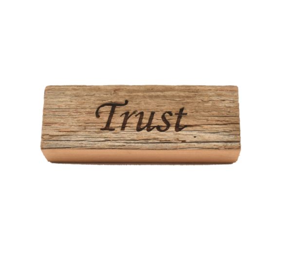 Reclaimed barnwood sign that reads, "Trust".