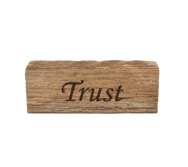 Reclaimed barnwood sign that reads, "Trust".