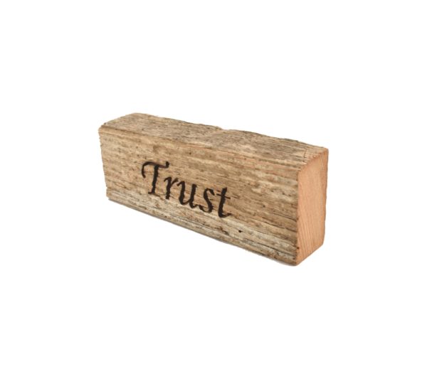 Reclaimed barnwood sign that reads, "Trust".