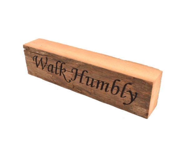 Reclaimed barnwood sign that reads, "Walk Humbly".