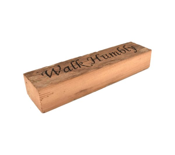 Reclaimed barnwood sign that reads, "Walk Humbly".