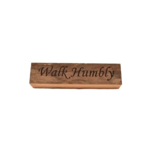 Reclaimed barnwood sign that reads, "Walk Humbly".