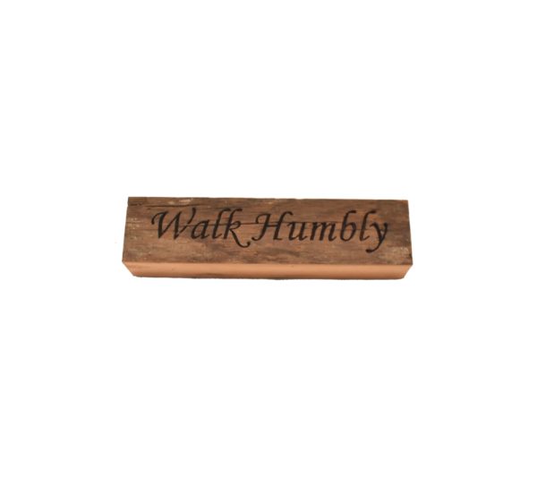 Reclaimed barnwood sign that reads, "Walk Humbly".