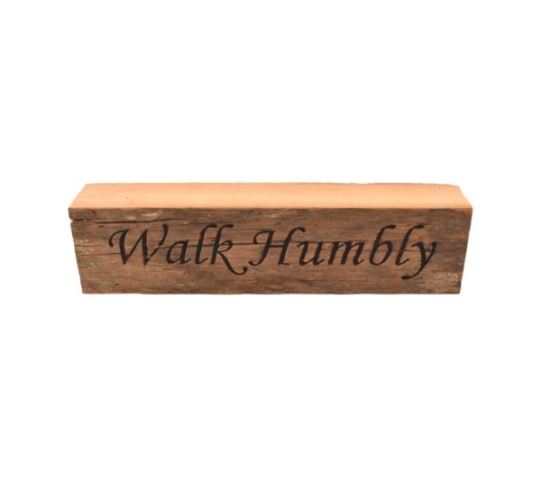 Reclaimed barnwood sign that reads, "Walk Humbly".