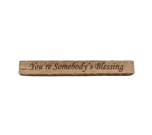 Reclaimed barn wood block sign that reads, "You're Somebody's Blessing".