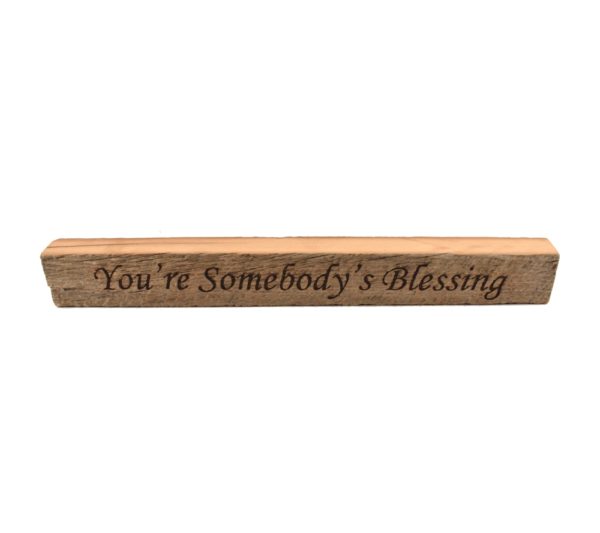 Reclaimed barn wood block sign that reads, "You're Somebody's Blessing".