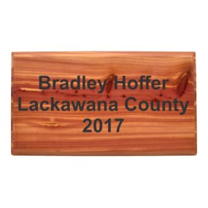 Rectangle information plaque engraved in cedar.