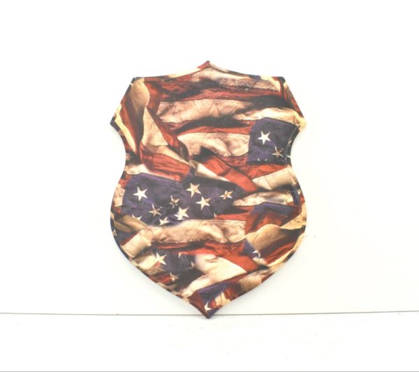 Shield plaque with United States flag inspired camo print.
