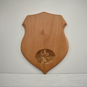 Shield taxidermy plaque with an engraved photo.
