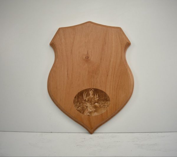Shield taxidermy plaque with an engraved photo.