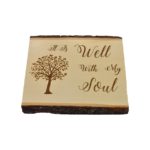Engraved live edge sign that reads, "It Is Well With My Soul".