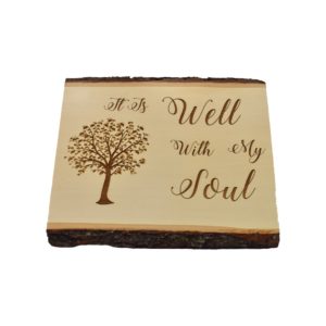 Engraved live edge sign that reads, "It Is Well With My Soul".