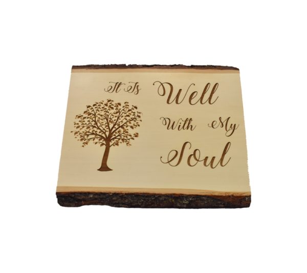 Engraved live edge sign that reads, "It Is Well With My Soul".