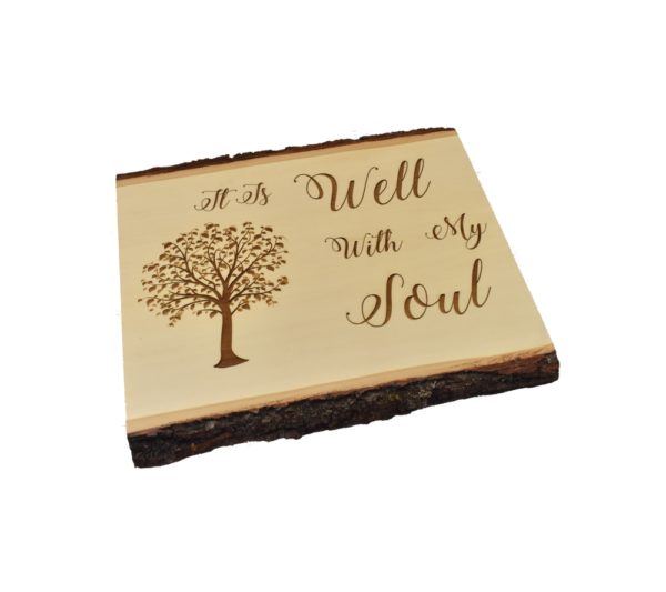 Engraved live edge sign that reads, "It Is Well With My Soul".