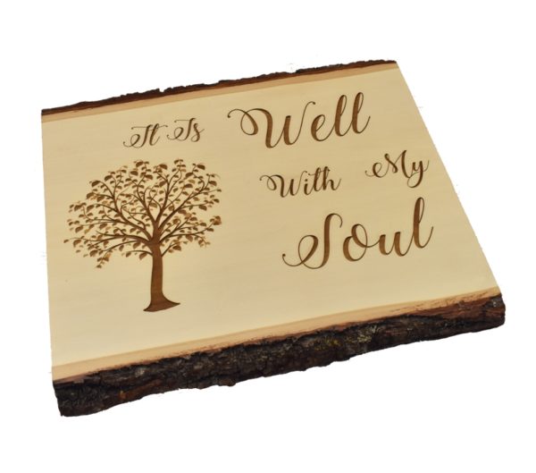 Engraved live edge sign that reads, "It Is Well With My Soul".