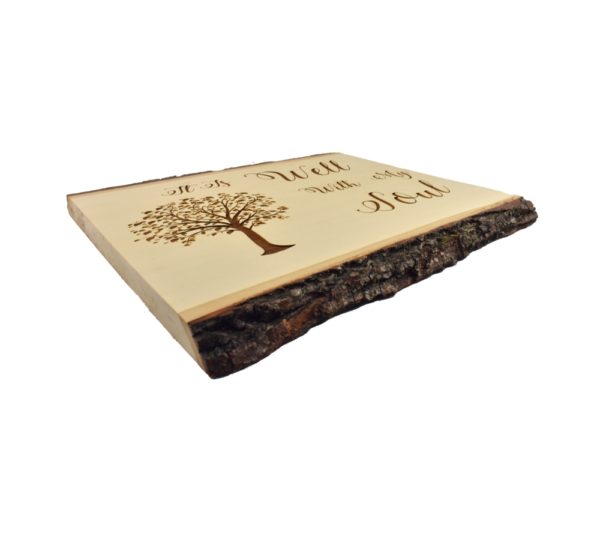 Engraved live edge sign that reads, "It Is Well With My Soul".