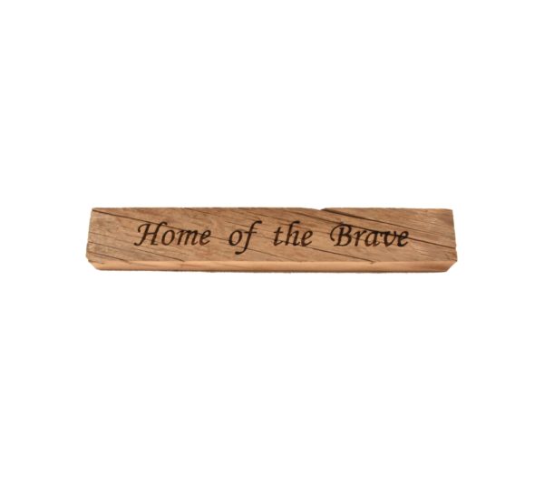 Reclaimed barn wood block sign that reads, "Home of the Brave".