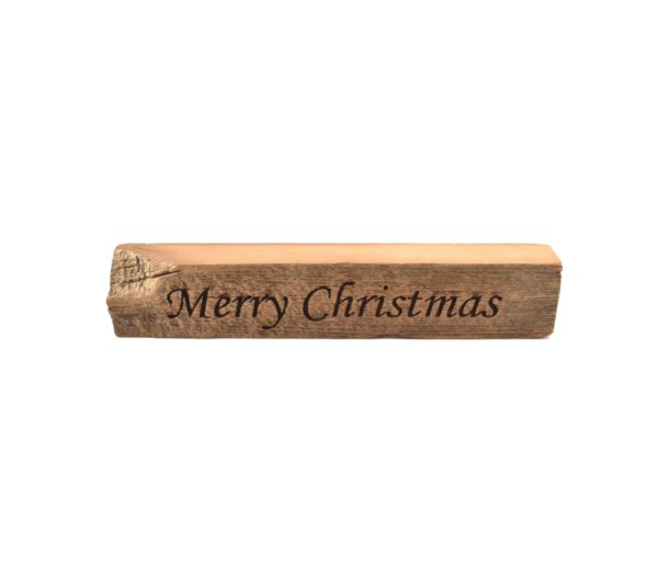 Reclaimed barn wood block sign that reads, "Merry Christmas".