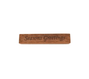 Reclaimed barn wood block sign that reads, "Seasons Greetings".