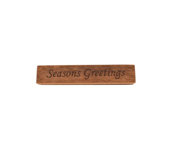 Reclaimed barn wood block sign that reads, "Seasons Greetings".