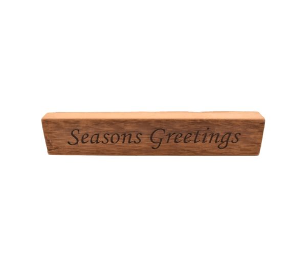 Reclaimed barn wood block sign that reads, "Seasons Greetings".