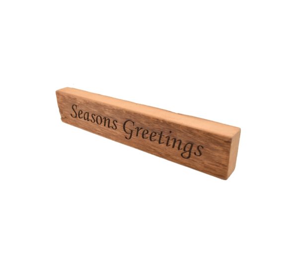 Reclaimed barn wood block sign that reads, "Seasons Greetings".