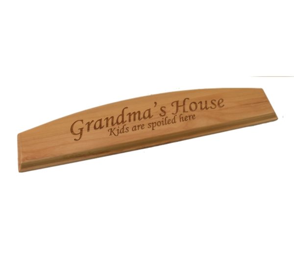 Engraved hardwood door topper.
