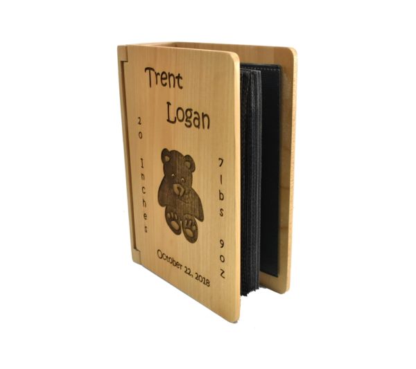 Personalized three ring wooden photo album.