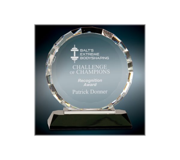 Custom engraved, round faceted award on a black base.