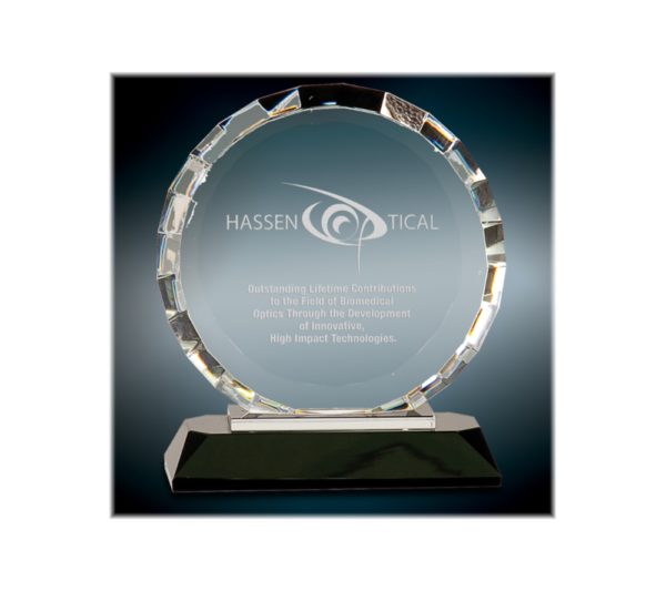 Custom engraved, round faceted award on a black base.