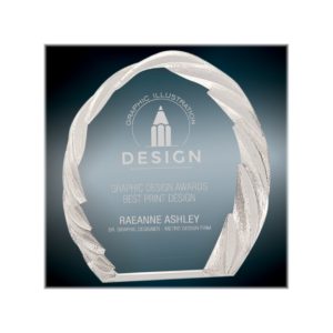 Rounded crystal award with decorative edge.