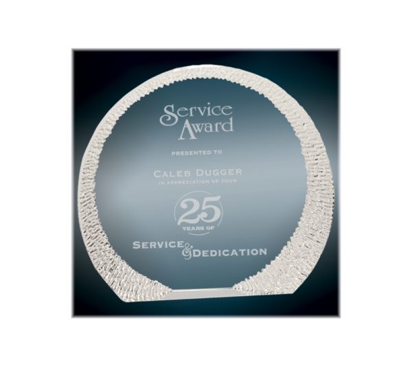 Rounded crystal award with decorative edge.