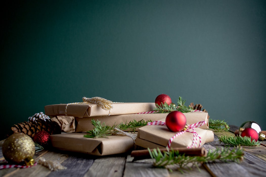 Christmas presents sitting on wooden table