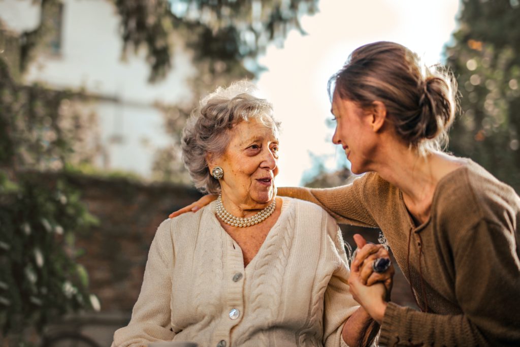 Mother embracing daughter to thank her for her gift package and personalized gift ideas. 