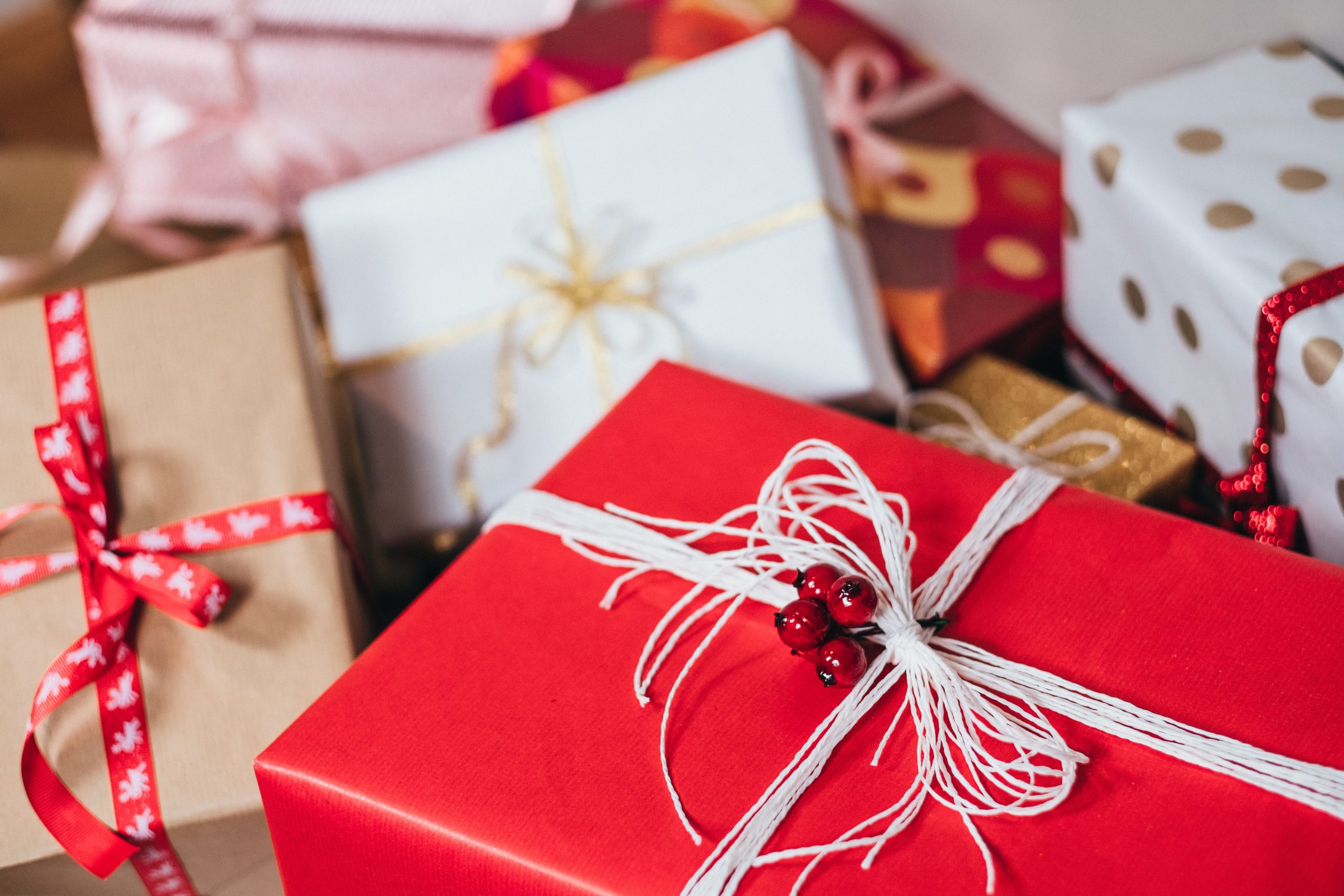 Gift table filled with brightly wrapped presents